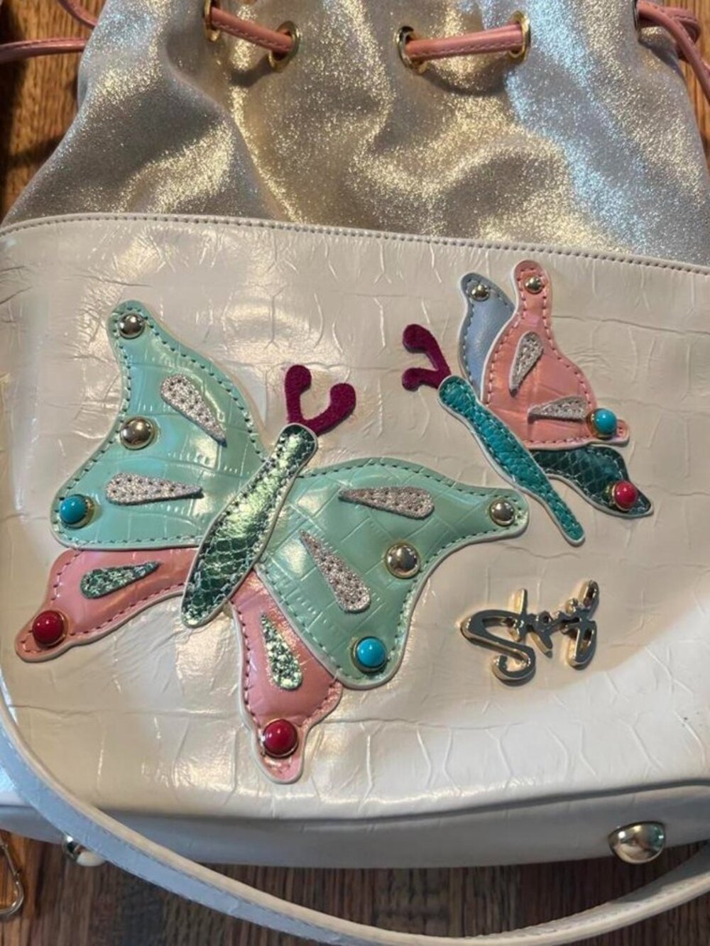 Collectible Sharif  champagne and Pearl White with hot pink interior